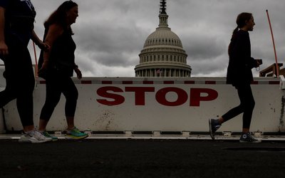 Tourists walk past the U.S. Capitol in Washington