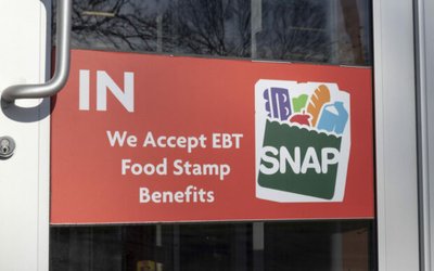 SNAP and EBT Accepted here sign. SNAP and Food Stamps provide nutrition benefits to supplement the budgets of disadvantaged families.