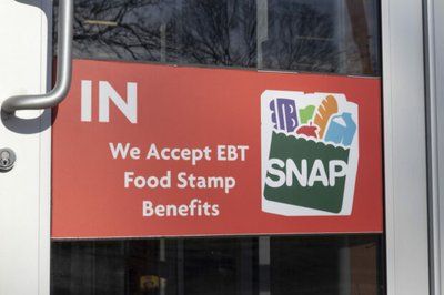 SNAP and EBT Accepted here sign. SNAP and Food Stamps provide nutrition benefits to supplement the budgets of disadvantaged families.