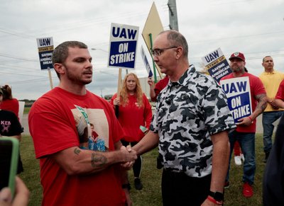 United Auto Workers president Shawn Fain meets with striking UAW members from the General Motors Lansing Delta Plant, as they picket in Delta Township