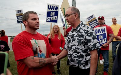 United Auto Workers president Shawn Fain meets with striking UAW members from the General Motors Lansing Delta Plant, as they picket in Delta Township