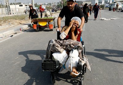 Palestinians fleeing north Gaza move southward, in the central Gaza Strip