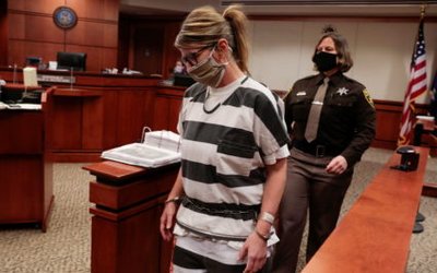 Jennifer Crumbley, parent of accused Oxford High School gunman Ethan Crumbley, is escorted into the courtroom by a Oakland Count Sheriff