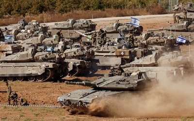An Israeli tank maneuvers, amid the ongoing conflict between Israel and the Palestinian Islamist group Hamas, near the Israel-Gaza Border, in southern Israel