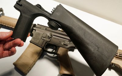 A bump fire stock that attaches to a semi-automatic rifle to increase the firing rate is seen at Good Guys Gun Shop in Orem