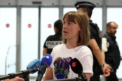 Swedish activist Greta Thunberg arrives at Paris airport
