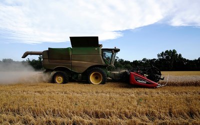 Farmer harvests winter wheat crop in Oklahoma