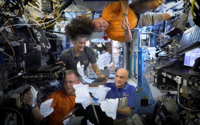 FILE PHOTO: NASA astronauts on ISS unbox Thanksgiving meals in space