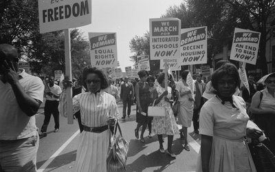 FILE PHOTO: A procession carrying signs for equal rights, integrated schools, decent housing, and an end to bias during the civil rights march on Washington D.C.