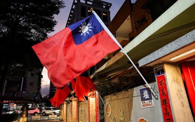 Taiwanese flags are installed along a street, in New Taipei city