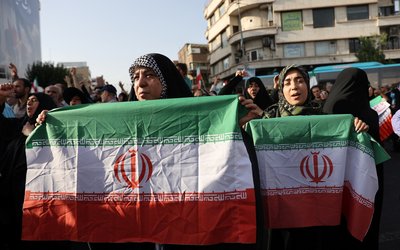 People attend a protest against the U.S attack on nuclear sites, in Tehran, Iran