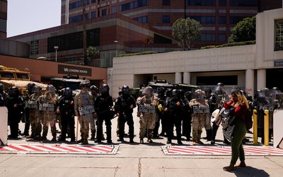Members of the California National Guard stand guard in downtown Los Angeles