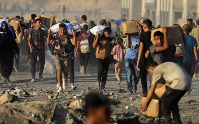 Palestinians receive aid supplies in Beit Lahia