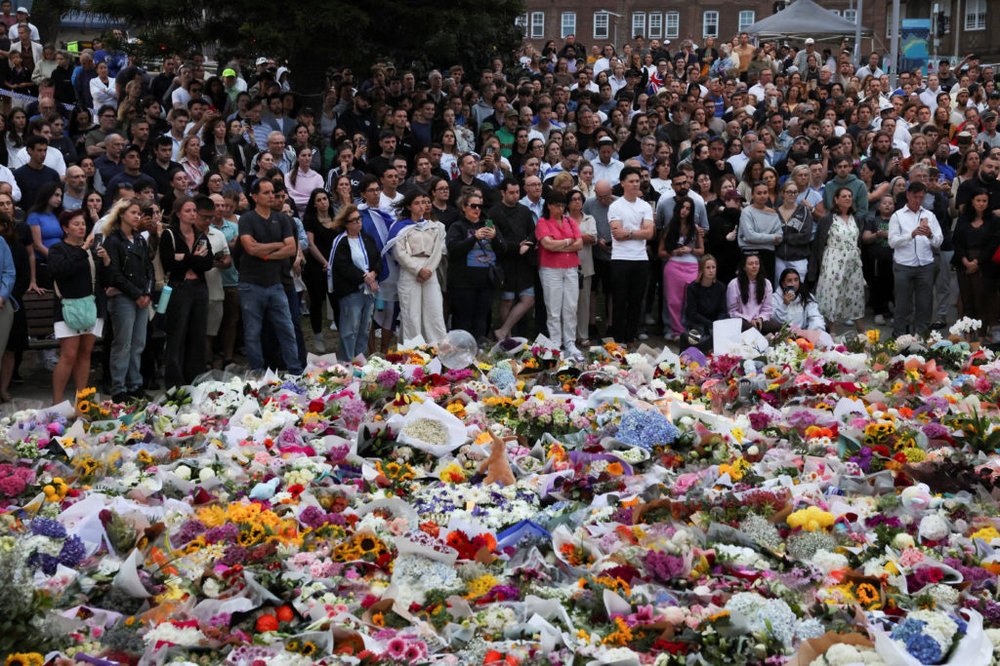 People pay respects at Bondi Pavilion to victims of a shooting during a Jewish holiday celebration at Bondi Beach, in Sydney