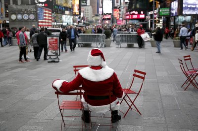 Santa Mark, a Santa Claus impersonator from Ansonia in Connecticut, sits in Times Square in the Manhattan borough of New York City.