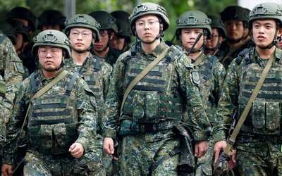 Taiwan reservists march during a training session at Loung Te Industrial Parks Service Center in Yilan,