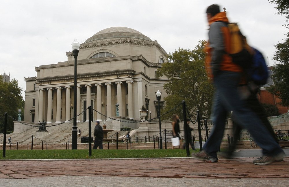 Students walk across the campus of Columbia University in New York