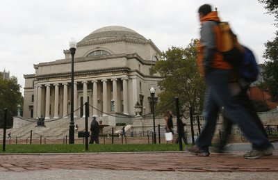 Students walk across the campus of Columbia University in New York