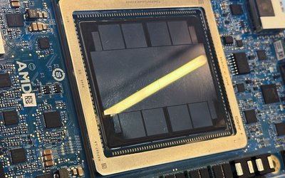 FILE PHOTO: An AMD MI350 series artificial intelligence chip is diplayed at the San Jose McEnery Convention Center