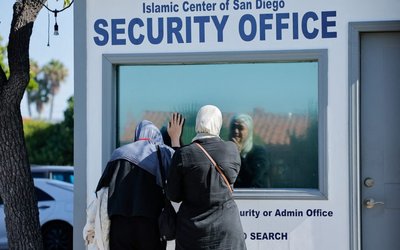 People pay their respects the morning following a shooting, at Islamic Centre of San Diego