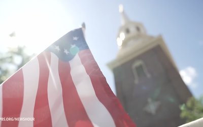 American flag in front of a church