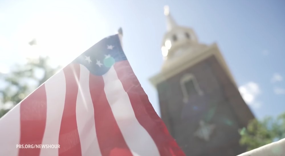 American flag in front of a church