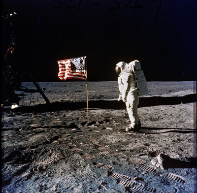 Astronaut Edwin E. (Buzz) Aldrin, Jr. Posing on the Moon Next to the U.S. Flag