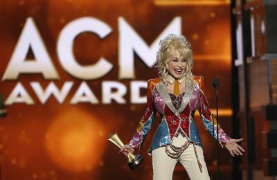 Dolly Parton accepts the Tex Ritter Award during the 51st Academy of Country Music Awards in Las Vegas