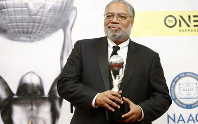 Dr. Lonnie G. Bunch III poses with his President's Award backstage at the 48th NAACP Image Awards in Pasadena