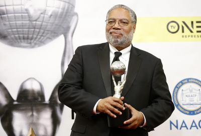 Dr. Lonnie G. Bunch III poses with his President's Award backstage at the 48th NAACP Image Awards in Pasadena