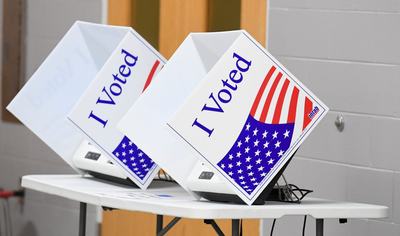 2026-06-23T212757Z_1519763688_MT1USATODAY29254705_RTRMADP_3_VOTING-BOOTHS-ARE-SET-UP-TUESDAY-JUNE-23-2026-DURING-THE-e1786392101996