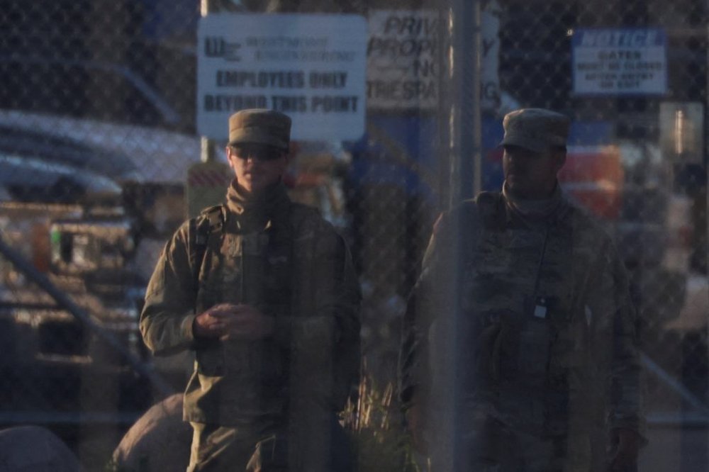 National Guard members walk at U.S. ICE Broadview facility in Chicago, Illinois