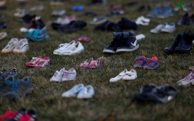 Activists install 7000 shoes on the lawn in front of the U.S. Capitol on Capitol Hill in Washington