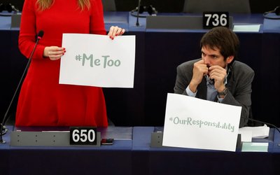 European Parliament member Terry Reintke holds a placard with the hashtag "MeToo" during a debate to discuss preventive measures against sexual harassment and abuse in the EU at the European Parliament in Strasbourg