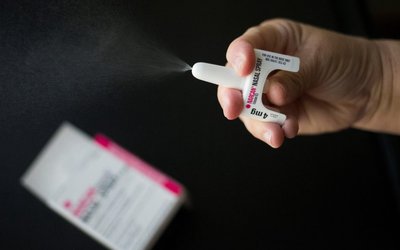 Nurse demonstrates application of NARCAN nasal spray medication at outpatient treatment center in Pennsylvania