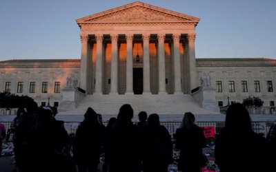 People gather to mourn the death of Associate Justice Ruth Bader Ginsburg at the Supreme Court in Washington