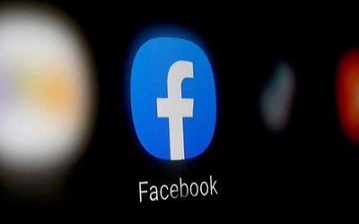 FILE PHOTO: A Facebook logo is displayed on a smartphone in this illustration