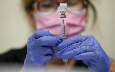 People receive COVID-19 booster vaccination in Michigan