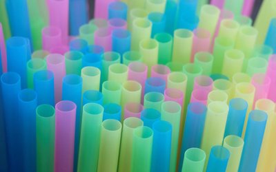 Drinking straws protrude from a glass in a illustration picture in Loughborough