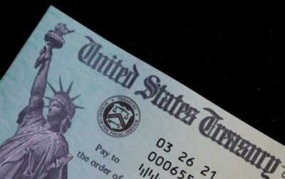 FILE PHOTO: A family's stimulus check from the U.S. Treasury for the coronavirus disease (COVID-19) aid arrived in the mail in Milton